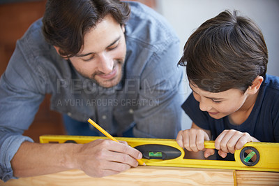 Buy stock photo Dad, kid and woodwork pencil for project, bonding and building with safety gear. Father, son and carpenter for renovating, measuring and teaching moment for development of house with spirit level