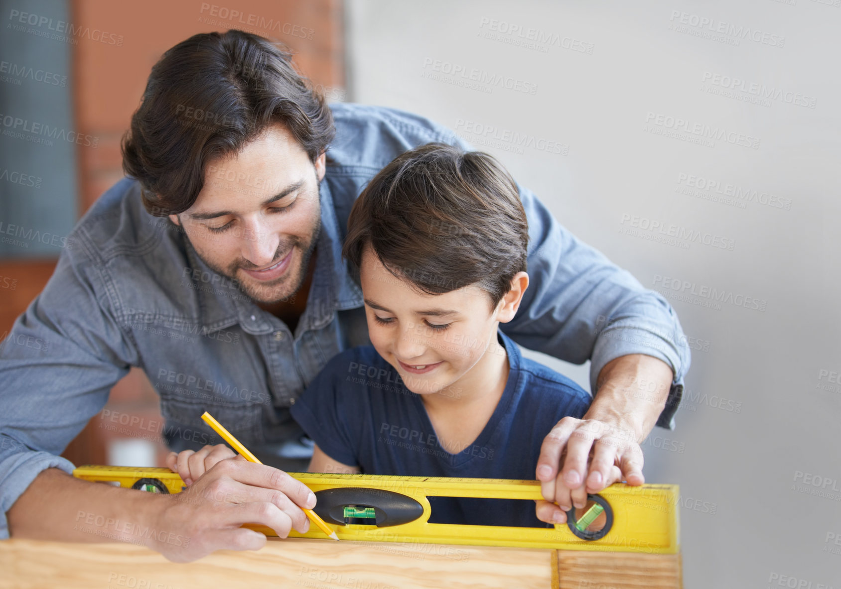 Buy stock photo A father and son doing woodwork together