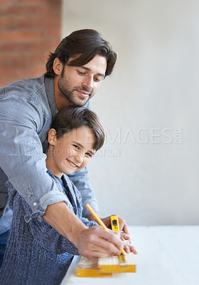 Buy stock photo Father, son and woodwork or teaching carpenter or measuring tape for helping, bonding or home repairs. Male person, child and face or parenting mentor for learning or furniture, lesson or building