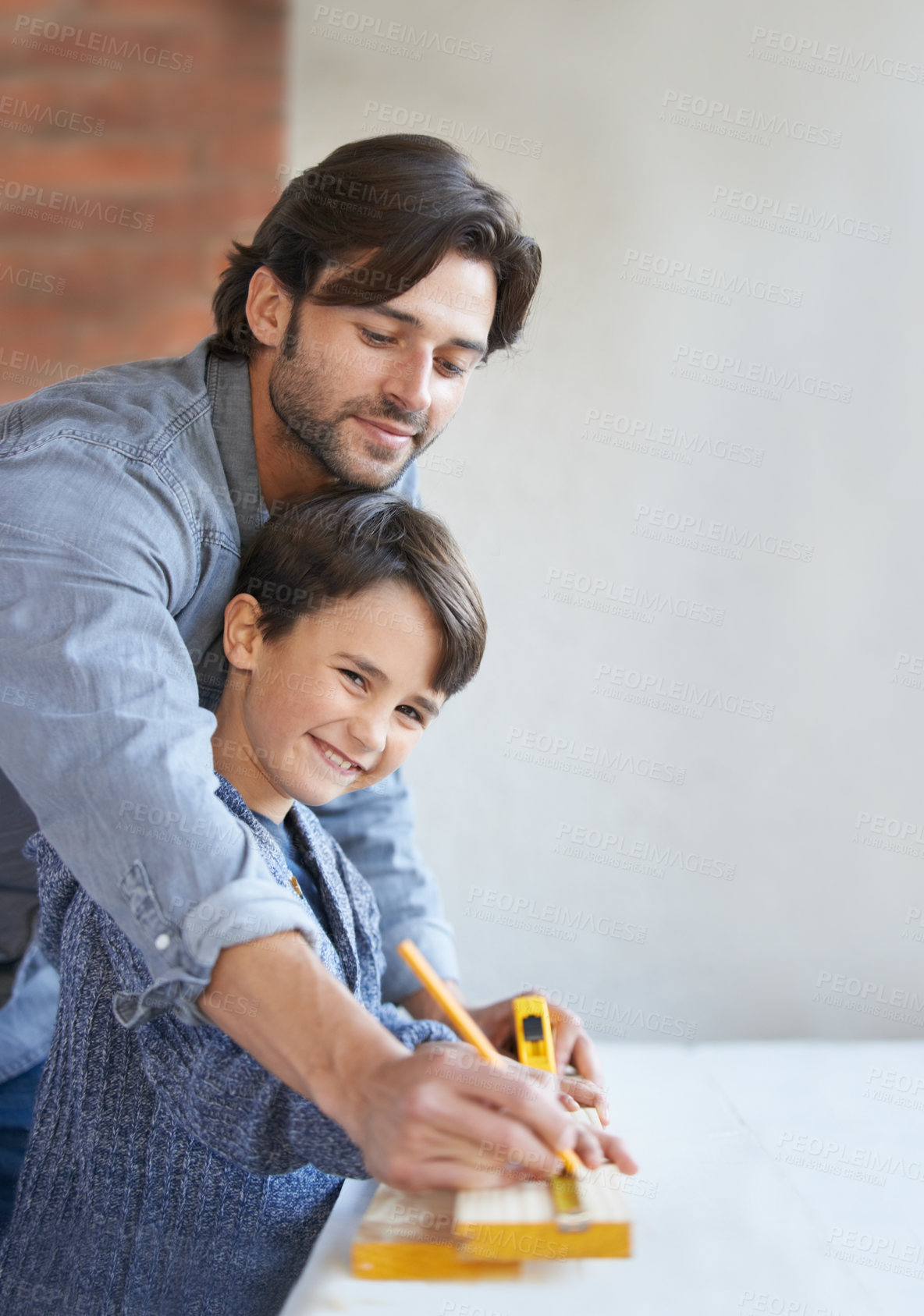 Buy stock photo Father, son and woodwork or teaching carpenter or measuring tape for helping, bonding or home repairs. Male person, child and face or parenting mentor for learning or furniture, lesson or building