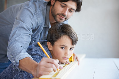 Buy stock photo Father, son and woodwork or teaching for furniture manufacturing for bonding, home repairs or construction. Male person, child and parenting for carpenter learning or renovation, lesson or building