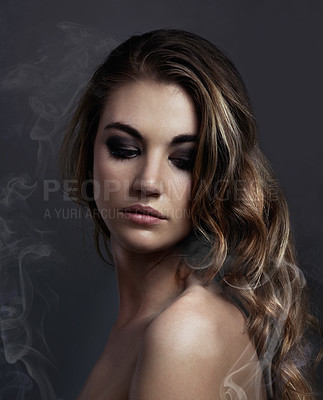 Buy stock photo Woman, eyeshadow and makeup, beauty and smoke with hair, cosmetics and balayage on grey background. Serious model, edgy with haircare and vapor, cosmetology and skin with mist or fog in studio