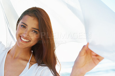 Buy stock photo Woman, beach and portrait with fabric in wind with smile for freedom, adventure and relax in nature by sea. Girl, person and happy with cloth on holiday, vacation and outdoor by ocean in Indonesia