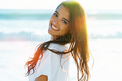 Buy stock photo Smile, portrait and woman on beach with flare, waves and sunset on summer holiday at sea in Hawaii. Smile, sun and face of girl on ocean vacation with adventure, travel and relax on tropical island.