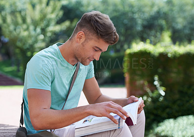 Buy stock photo Student, man and reading with books at park, campus or university for studying, development or knowledge. Person, college and outdoor in garden with thinking, information or scholarship for education