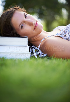 Buy stock photo Books, grass and portrait of woman relax, calm and resting for studying, reading and learning. Education, university and person outdoors for wellness, fresh air and peace with textbooks for knowledge