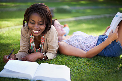 Buy stock photo Studying, university and students on grass with books for learning, knowledge and reading in park. Education, friends and women with textbook for information, exam preparation and college outdoors