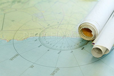 Buy stock photo Shot of nautical maps on a table