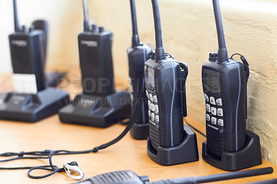 Buy stock photo Charge, radio and walkie talkie for communication, equipment and battery with connection. Technology, tools and receiver with transmitter, portable and security with protection, energy and network