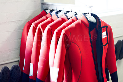 Buy stock photo Safety, sea and wetsuits of life guard on hanger for emergency, protection and lifesaver. Marine, security and saving with uniform of search and rescue for accident, summer and helping