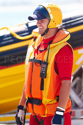 Buy stock photo A sea rescue worker and his speedboat
