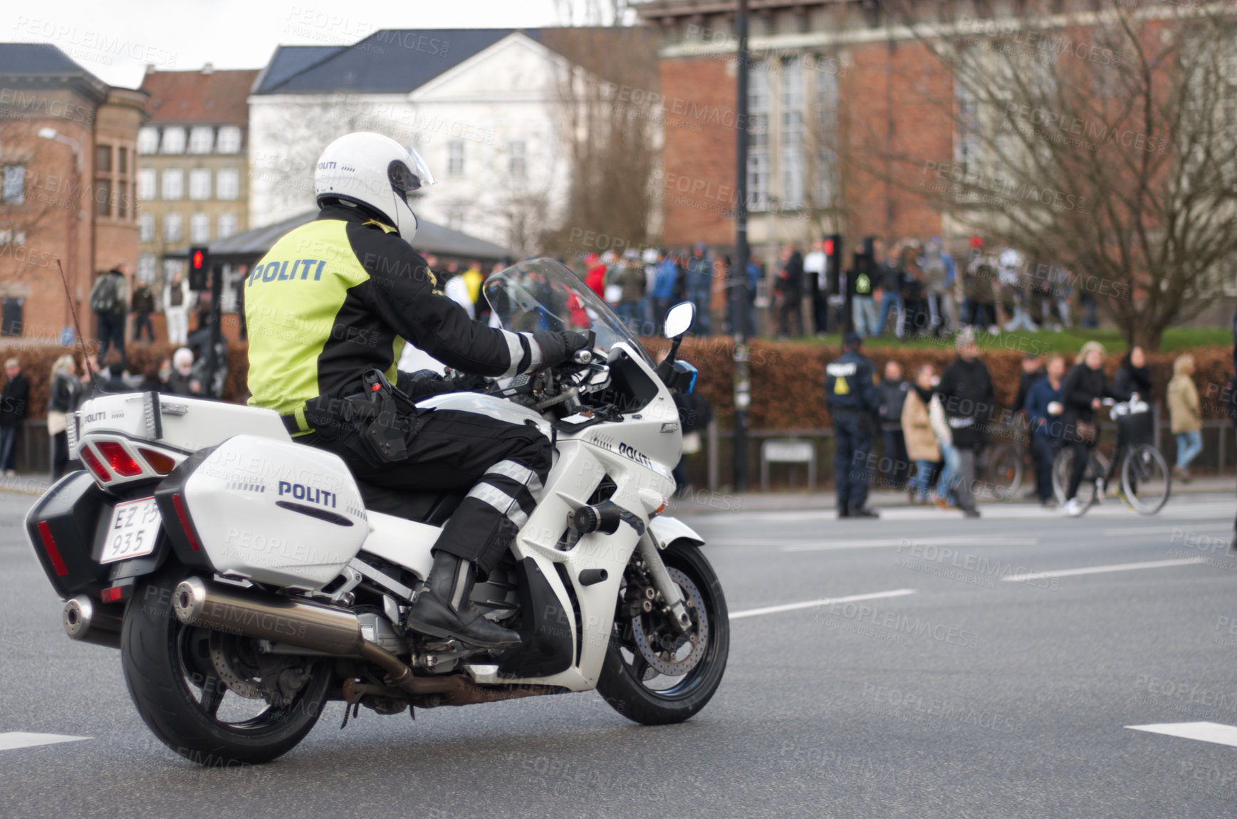 Buy stock photo Emergency, motorbike and police or safety officer working for protection and peace in an urban town in Denmark. Security, law and legal professional or policeman on a motorcycle ready for service
