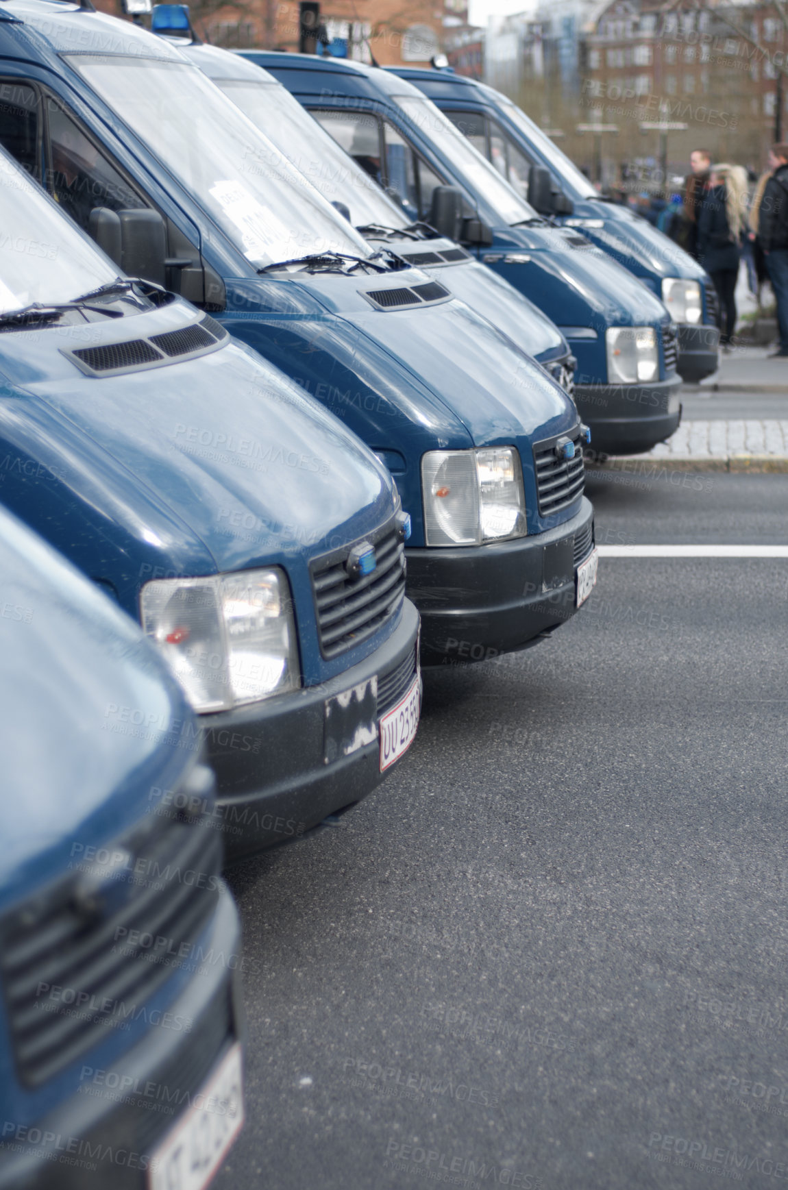 Buy stock photo Security, police and row of vans in the city for a public service during a protest or march. Safety, crime and law enforcement transport in a line as a barrier in an urban town strike for protection.
