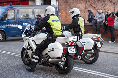 Buy stock photo Police, law enforcement and men on motorcycle in street with transport, public servant and security in the city. Safety, male people on patrol or escort for event with policeman on transportation 