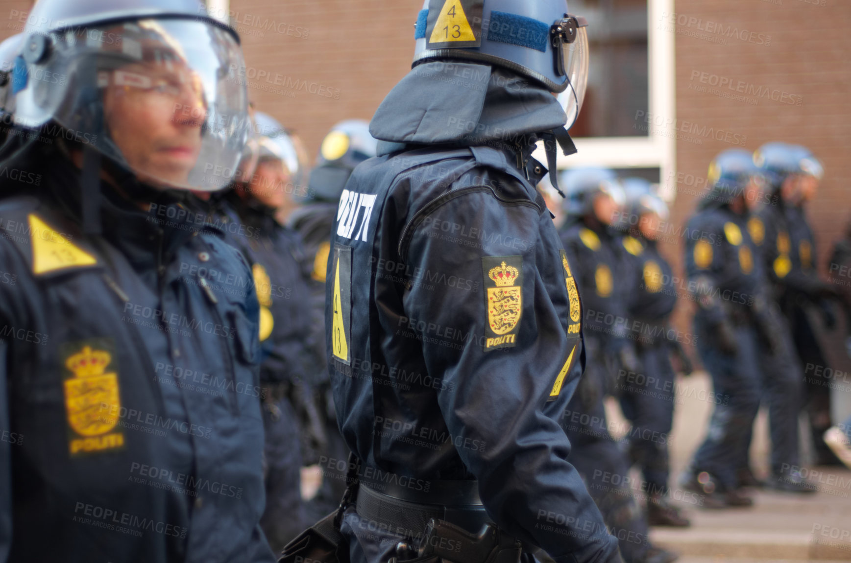 Buy stock photo Shot of a line of riot police