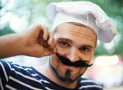 Buy stock photo A young man dressed up in a beret and a fake mustache