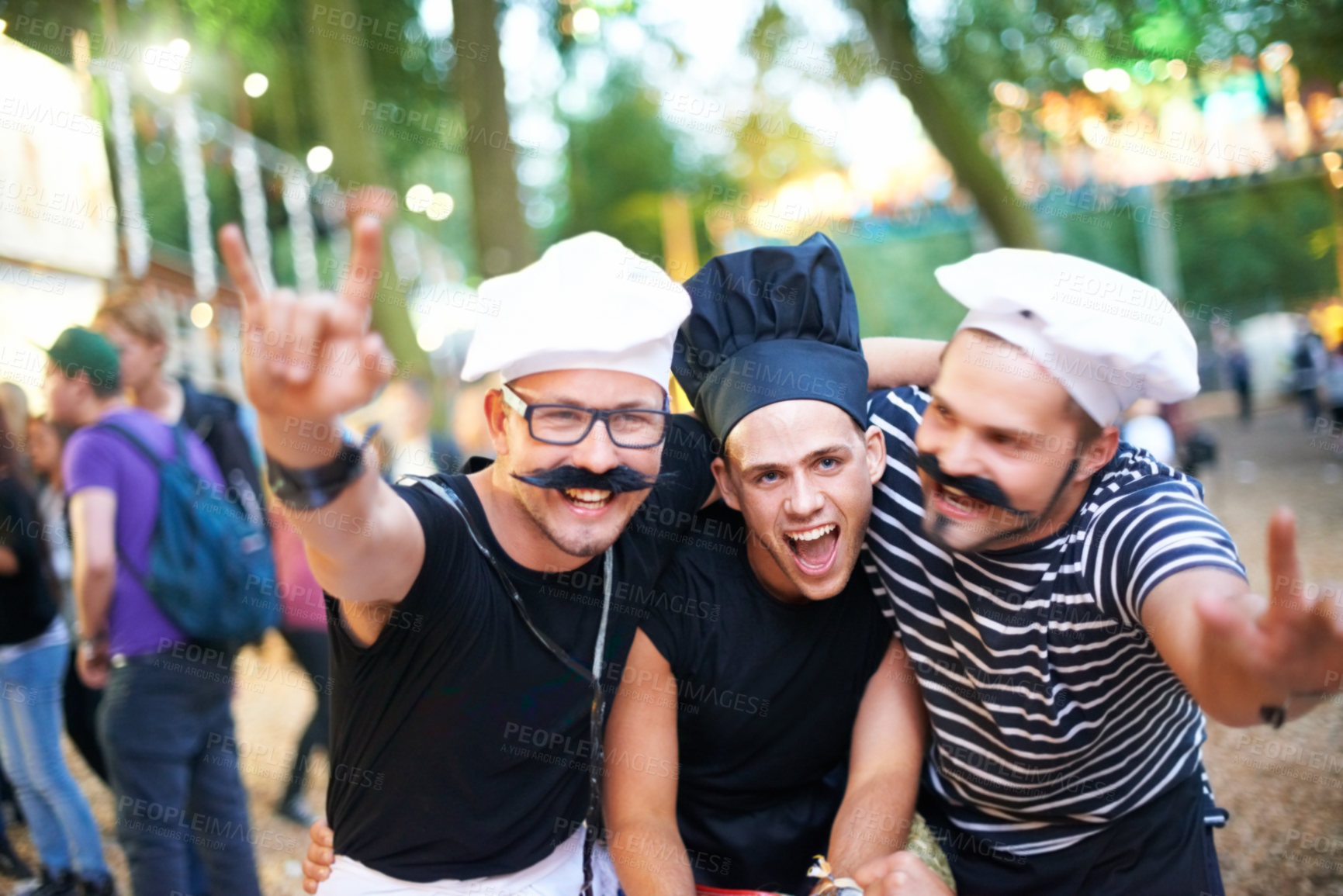 Buy stock photo Cropped portrait of some guy friends at a festival