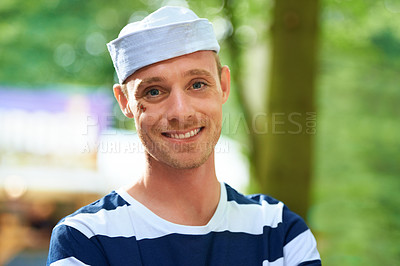 Buy stock photo Portrait, music festival and outdoor with man, costume and happiness with weekend break and holiday. Face, person or cheerful guy with Halloween clothes and concert with sailor outfit or summer party