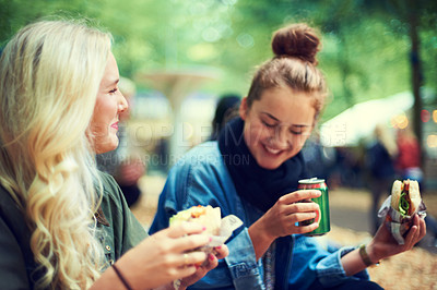 Buy stock photo Snack, women and music festival with friends, conversation and happiness with joy and bonding together. People, outdoor and girls with fast food and takeaway with summer break or concert with culture