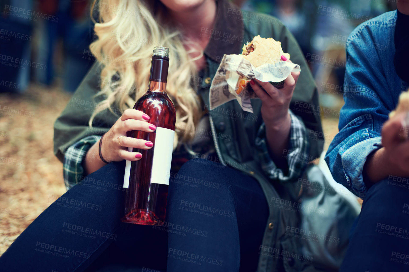 Buy stock photo Snack, woman and music festival with friends, beer and happiness with joy and bonding together. Alcohol, outdoor and girl with fast food or takeaway with summer break or concert with culture or event