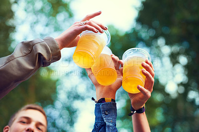 Buy stock photo Friends, beer and toasting in nature for celebration, bonding and unity in Canada from low angle. Group of people, hands and cups with alcohol for fun, entertainment and enjoyment outdoors in forest