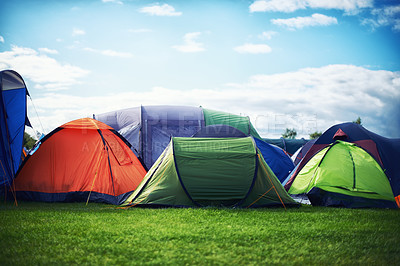 Buy stock photo A large group of tents pitched together outdoors 