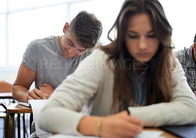 Buy stock photo University, man and woman in classroom writing test with learning, opportunity and future. Education, knowledge and growth for college student in lecture, studying in notebook for exam or development