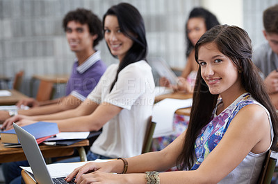 Buy stock photo College, laptop and portrait of woman in classroom typing with smile, learning and future opportunity. Education, knowledge and growth for group of students in university lecture studying for exam.