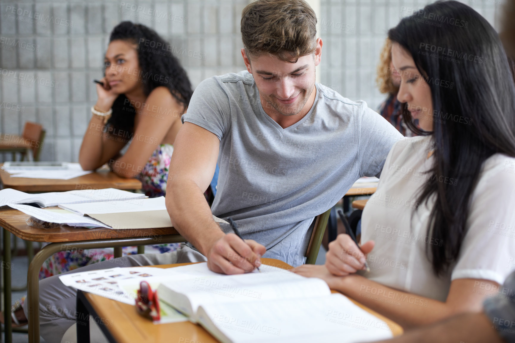 Buy stock photo Shot of young college students studying in class