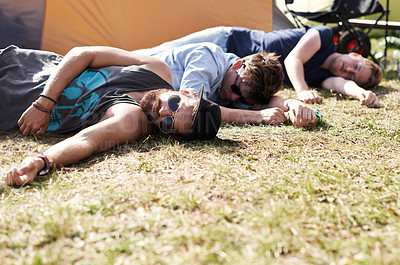 Buy stock photo Drunk sleeping, hangover and party people on camping park at music festival with alcohol. Field, ground and lawn with a tent and youth on grass with male friends and man camper at concert outdoor