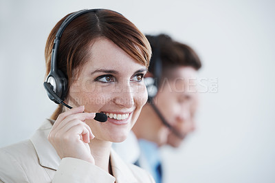 Buy stock photo Shot of a beautiful young customer service agent working in an office