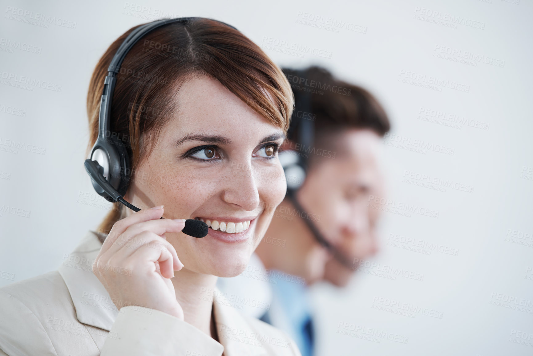 Buy stock photo Shot of a beautiful young customer service agent working in an office