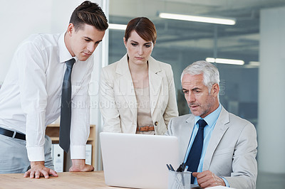 Buy stock photo Business people, laptop and discussion on proposal in boardroom, communication and meeting in office. Senior manager, employees and technology for assistance in training, mentor and advice for work