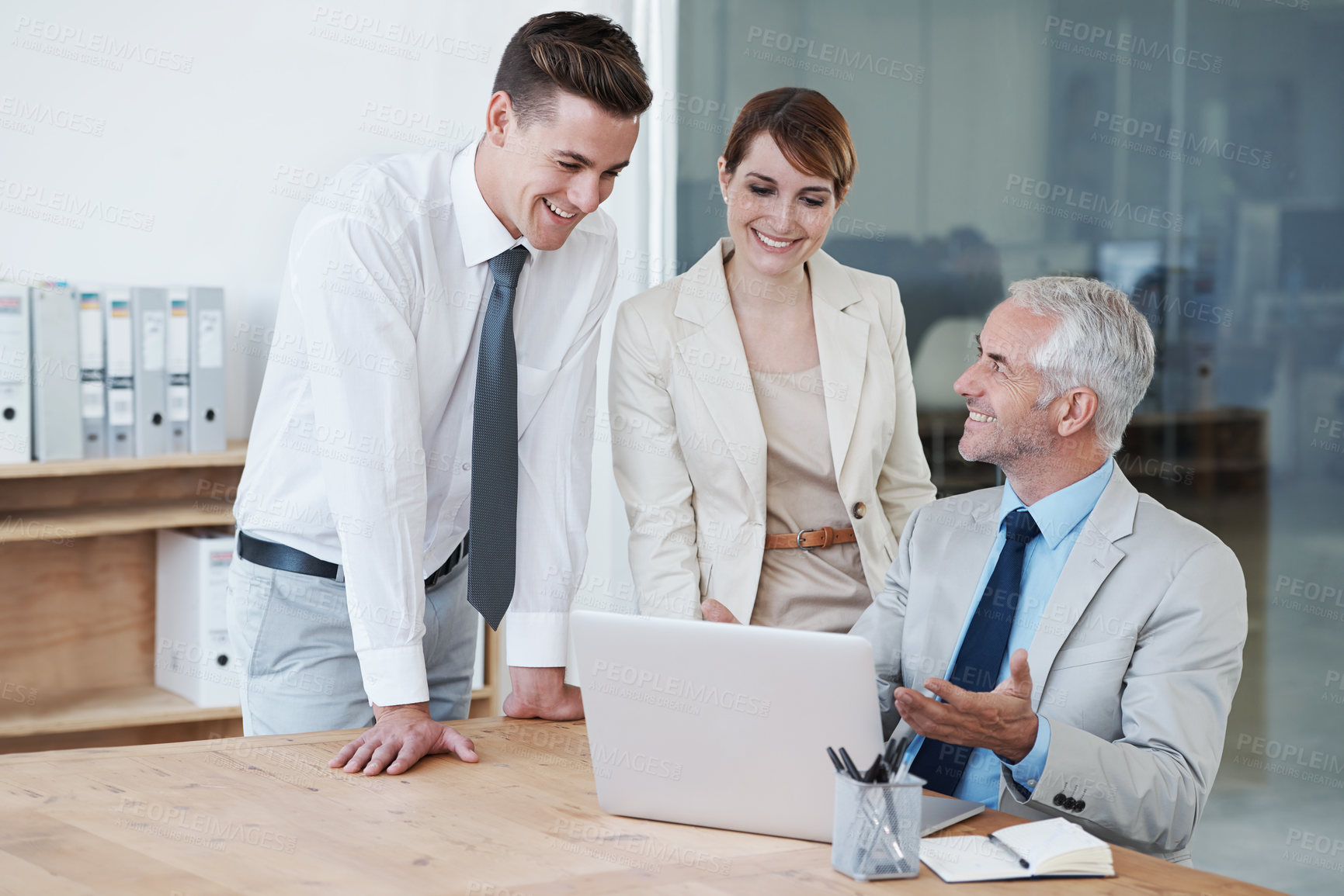 Buy stock photo Laptop, meeting and business people in discussion in office for corporate legal project. Conversation, technology and professional team of lawyers working on computer by desk together in workplace.