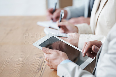 Buy stock photo People, meeting and desk with closeup on tablet for business meeting, working and conference room. Businessman, boardroom and information technology with hand, digital touchscreen and corporate job