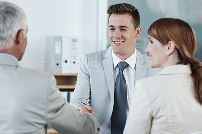 Buy stock photo Shaking hands, interview and hr with candidate in office for business meeting, discussion or recruitment. Handshake, hiring and man talking to human resources managers in workplace boardroom.