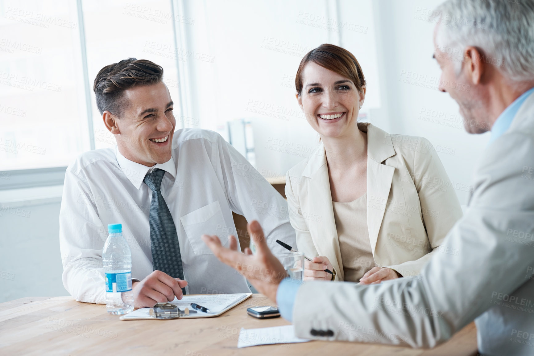 Buy stock photo Laughing,, smile or business people in meeting for teamwork or planning growth strategy ideas. Happy, humor and CEO speaking of funny joke with group of employees, colleagues or workers in boardroom