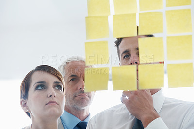 Buy stock photo Team, sticky notes and glass wall for planning, thinking and vision for logistics and ideas. Management, brainstorming and collaboration for meeting, goal and teamwork for discussion and marketing