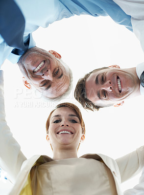Buy stock photo Business people, smile and huddle for happy success, collaboration or team building in portrait. Professional, colleagues and face in circle for support, motivation and solidarity from low angle