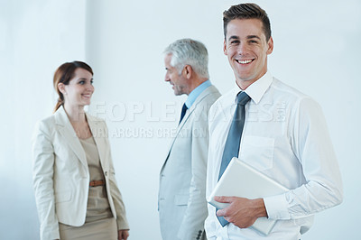 Buy stock photo Businessman, portrait and pride for career in office, confidence and smiling with laptop for leadership. Business people, communication and discussion in workplace, support and teamwork on technology