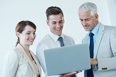 Buy stock photo Business people, laptop and discussion on proposal in office, communication and meeting in workplace. Coworkers, collaboration and happy with research on internet, planning and teamwork on technology