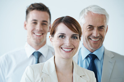 Buy stock photo Shot of a three corporate coworkers in an office