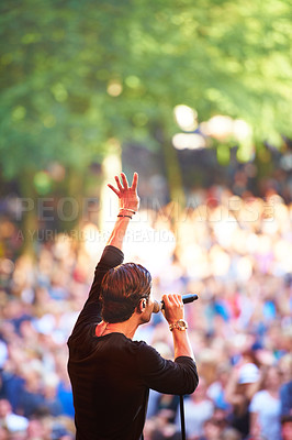 Buy stock photo Cropped shot of a large crowd at a music concert