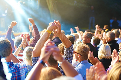 Buy stock photo Cropped shot of a large crowd at a music concert