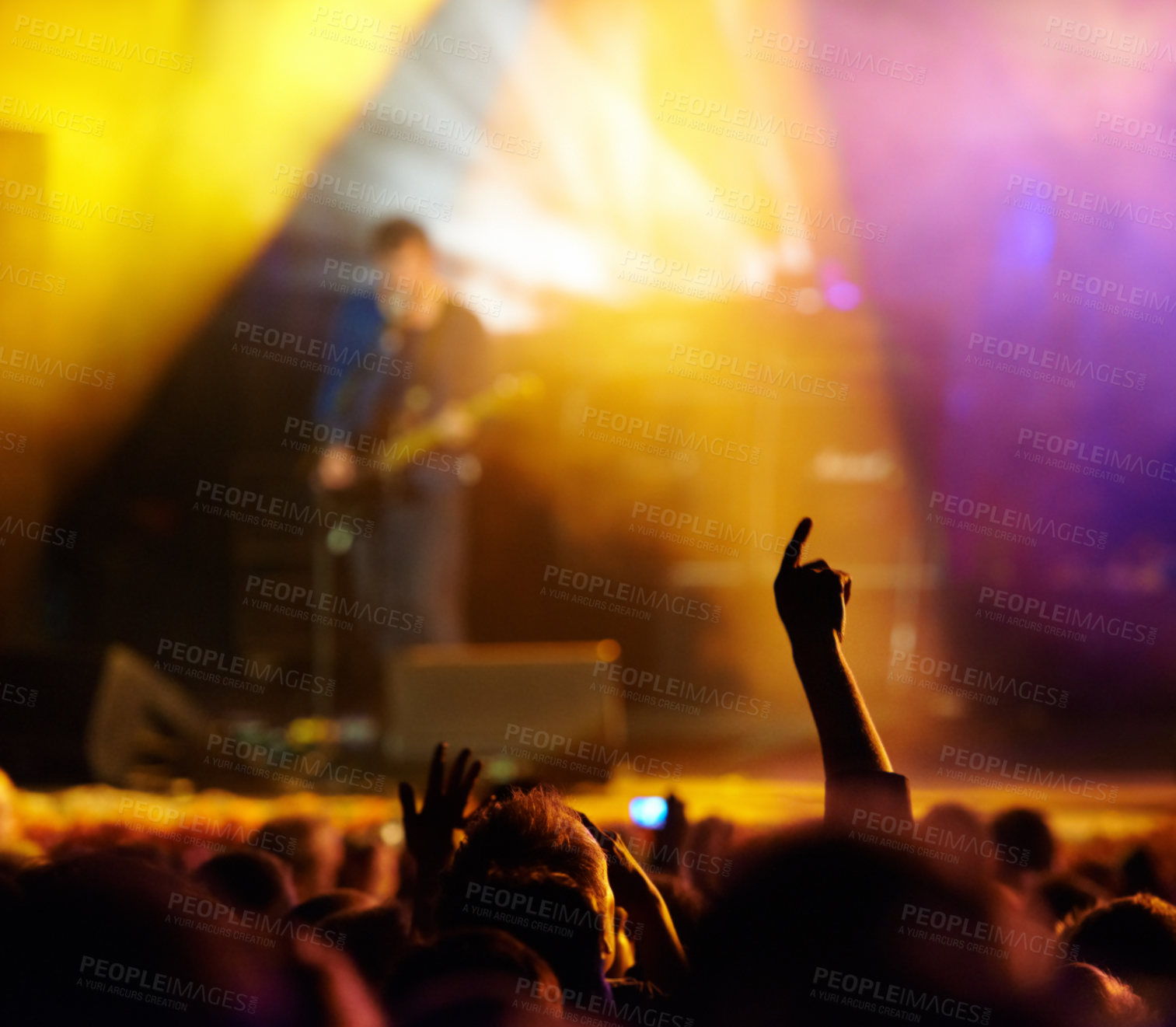 Buy stock photo Concert, audience and hands in crowd with band for music festival, night club and dancing with light. Disco, party and people with signs, gesture or performance at rock event with stage entertainment
