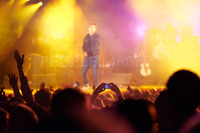 Buy stock photo Music festival, audience and hands in crowd with band for concert, night club and cheering with light. Disco, party and people with signs, gesture and performance at rock event with entertainment 