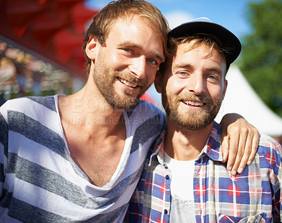 Buy stock photo Portrait of young male friends enjoying themselves at an outdoor festival