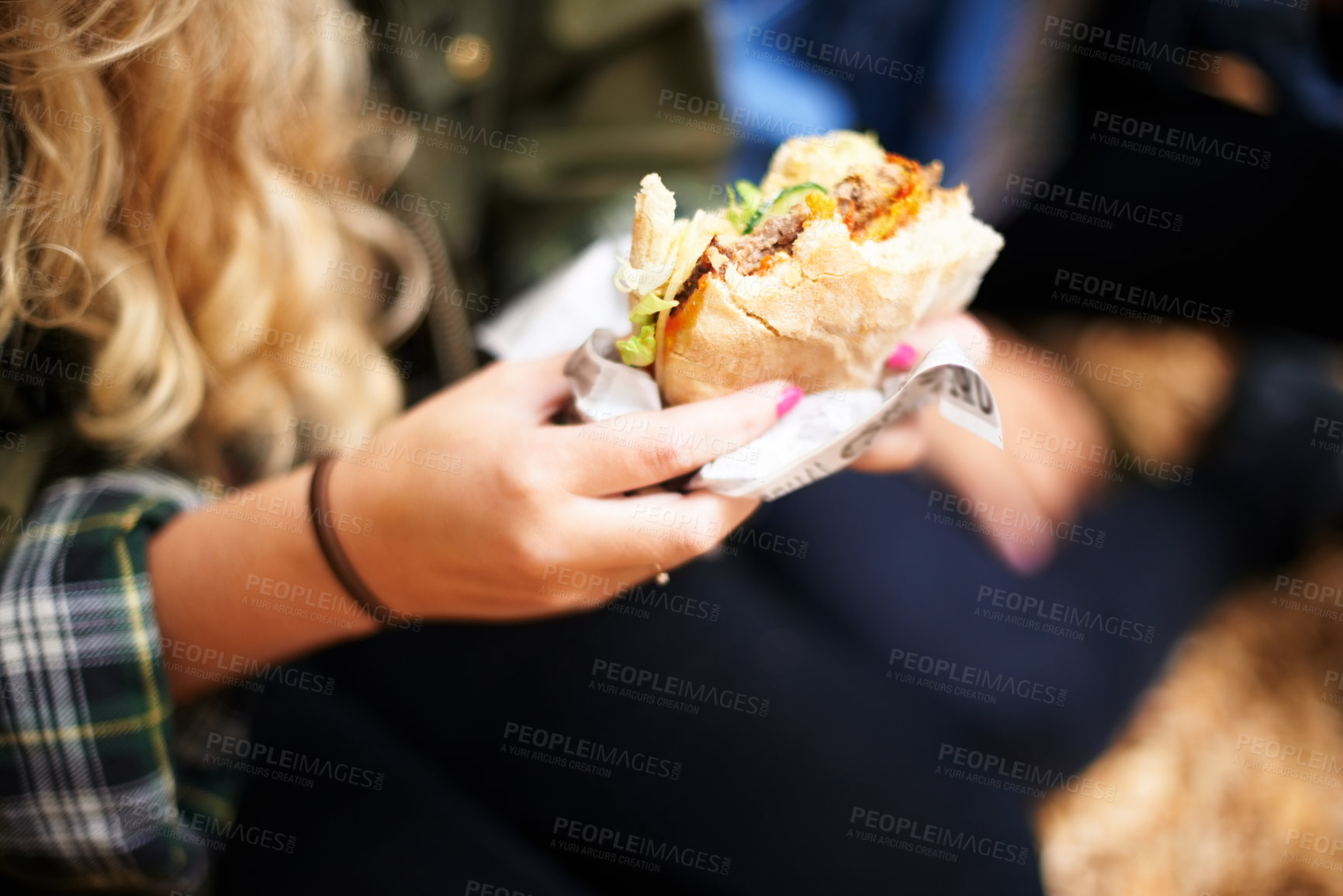 Buy stock photo Woman, hands and burger with hungry for food, nutrition and take away on holiday in outdoor. Person, eating and satisfaction with protein roll in hand, closeup or foodie outside on vacation leisure