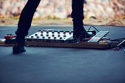 Buy stock photo Artist, stage and feet on equipment of instrument at concert, music festival or live event in Amsterdam. Performer, boots and pedal on platform for electric guitar for crowd, people and community