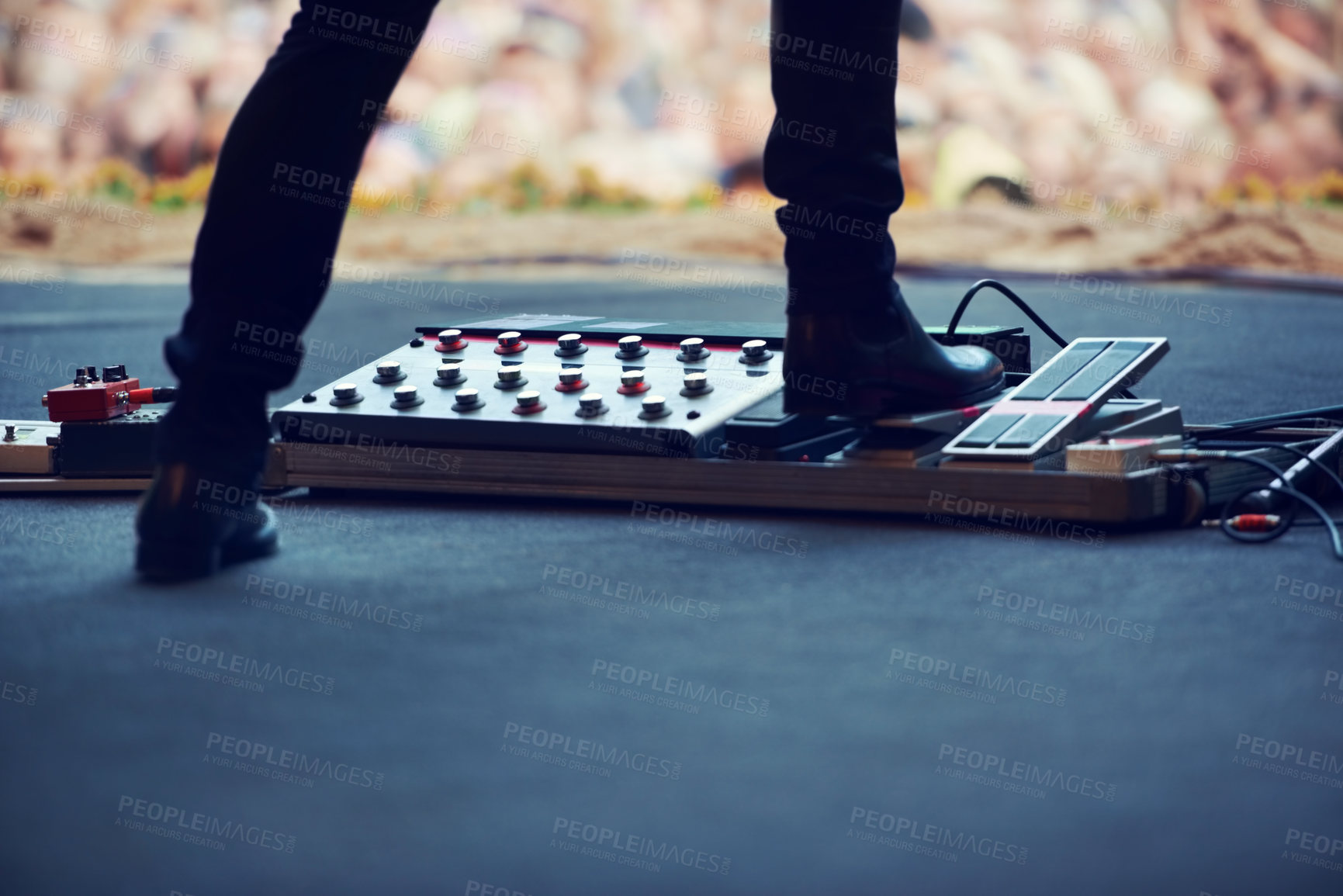 Buy stock photo Artist, stage and feet on equipment of instrument at concert, music festival or live event in Amsterdam. Performer, boots and pedal on platform for electric guitar for crowd, people and community